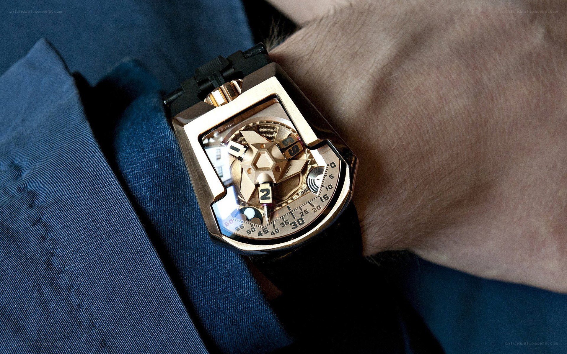 gold watch on wrist