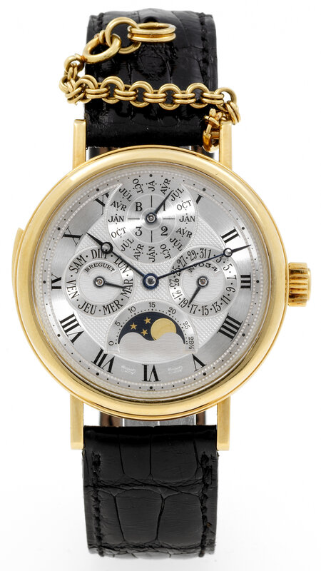 gold watch with black strap