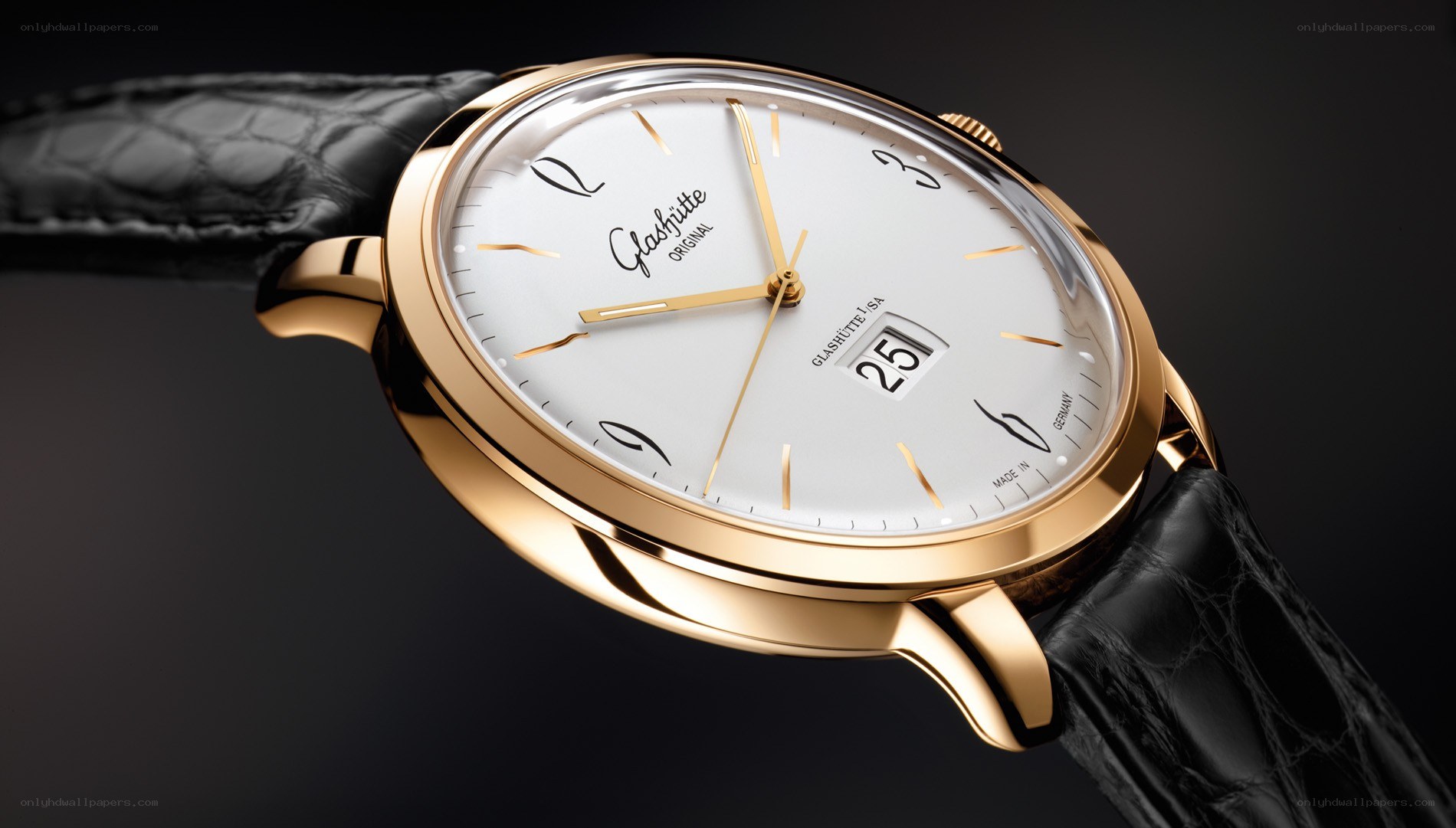 Gold watch with black strap