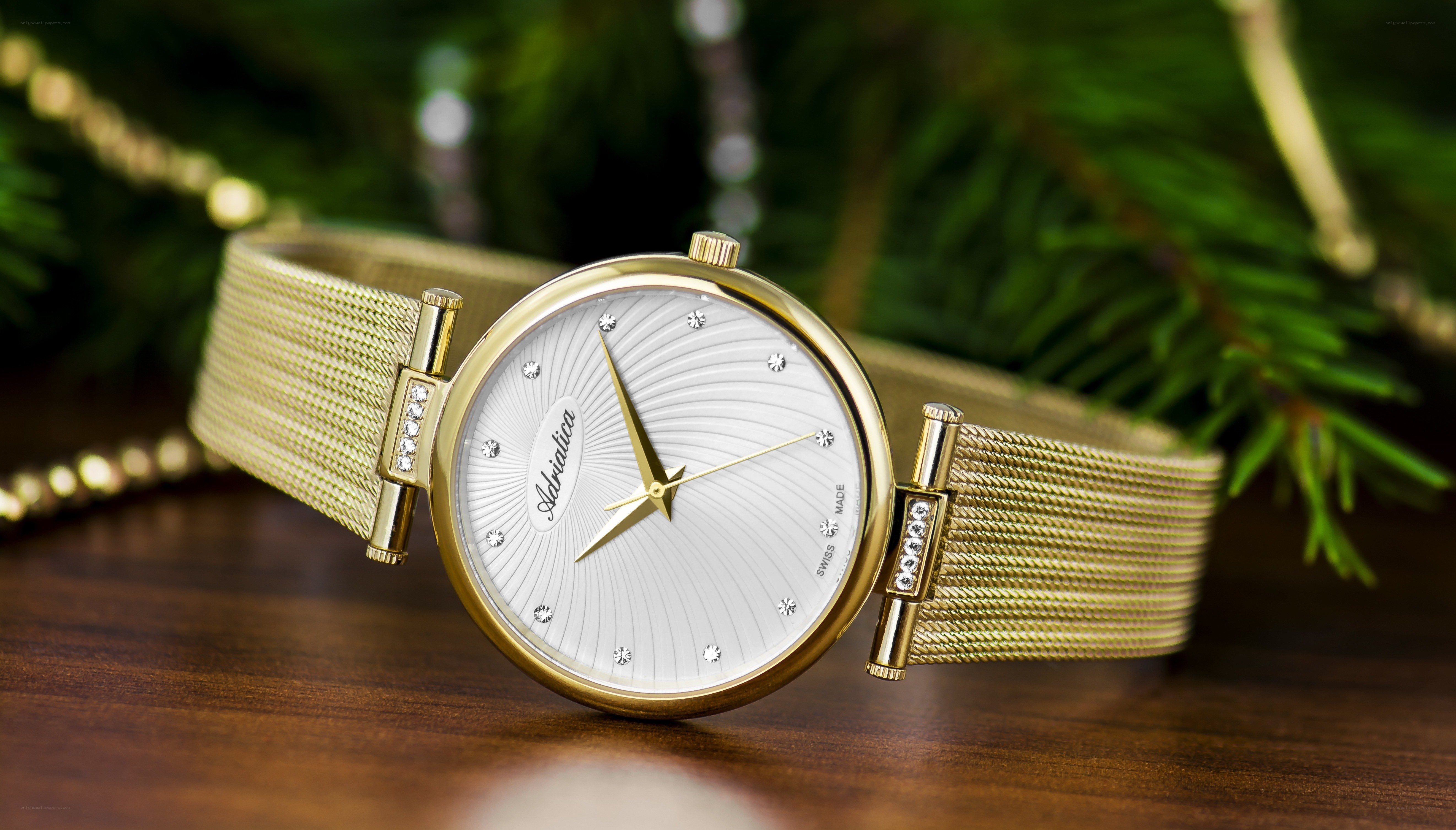 gold watch with diamond accents