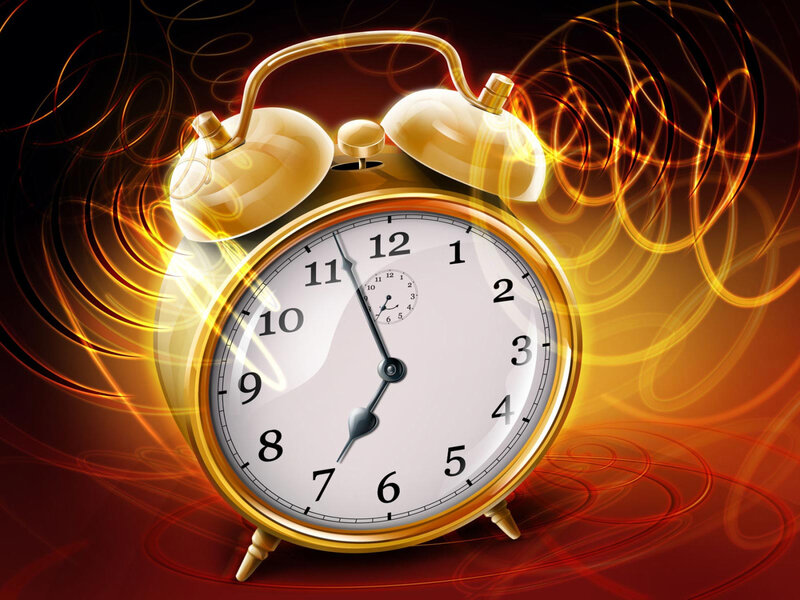 Golden alarm clock with energy swirls