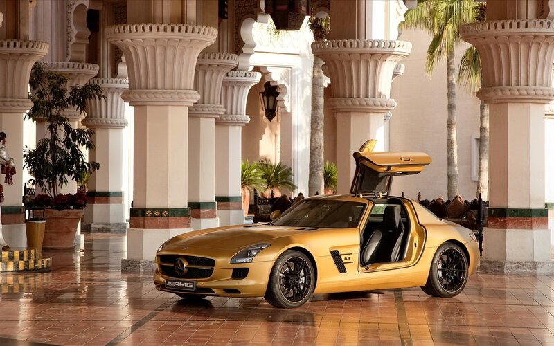 Golden AMG sports car in palace