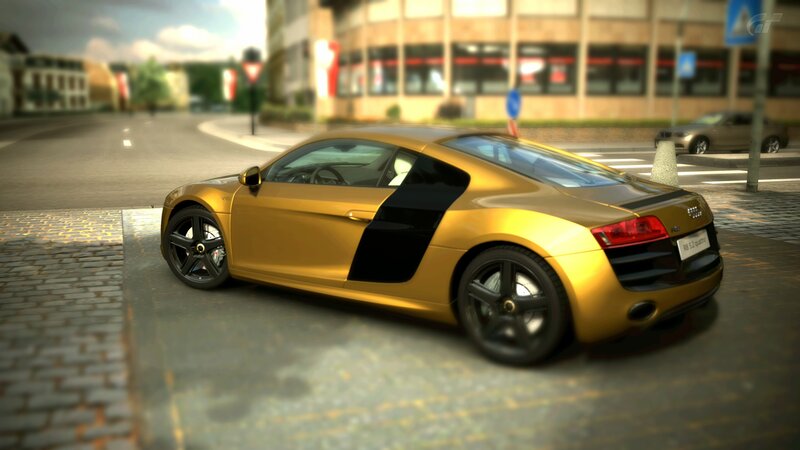 golden audi r8 on city street