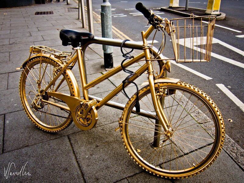 Golden Bicycle on Sidewalk