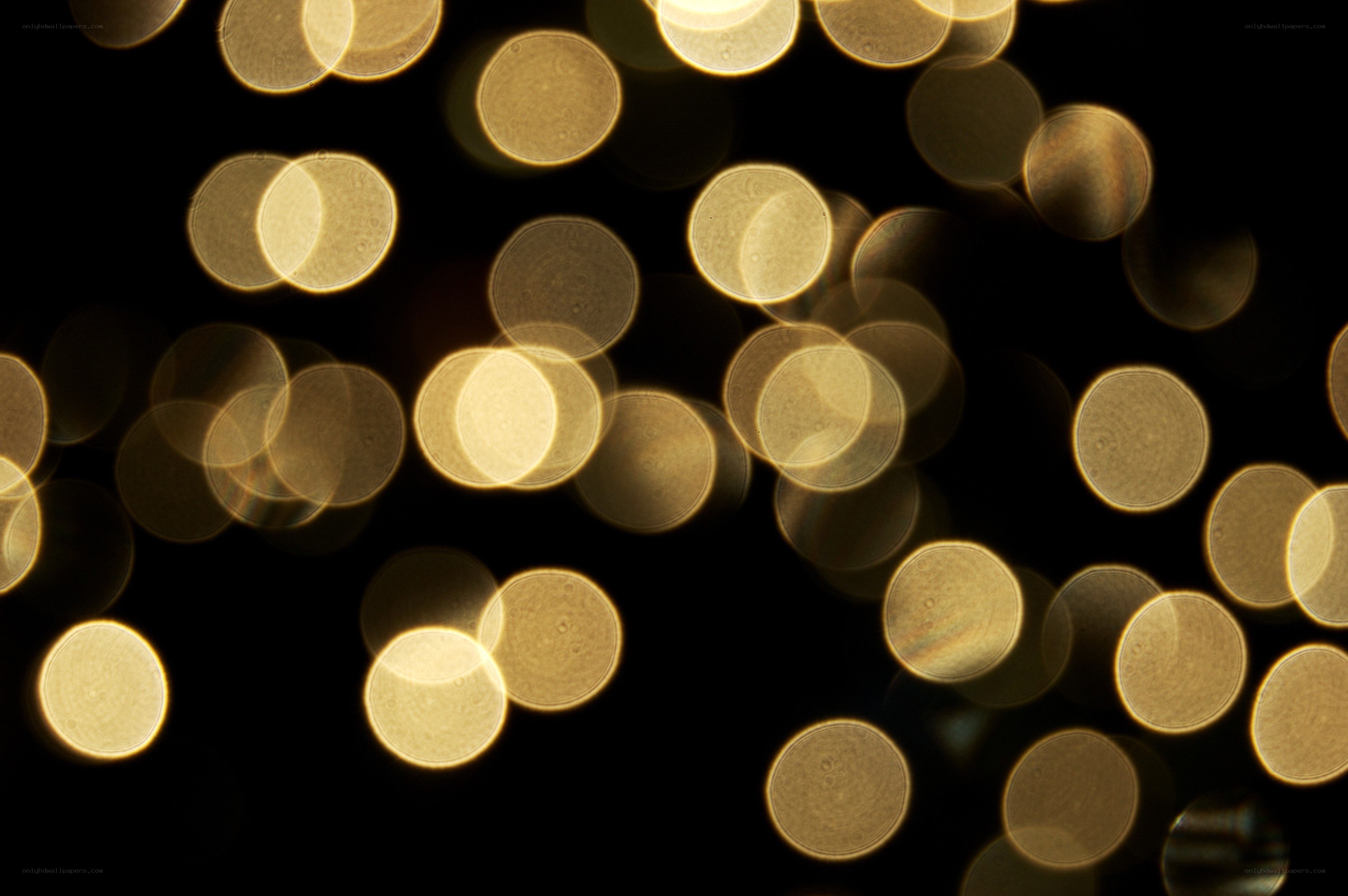 golden bokeh lights on black