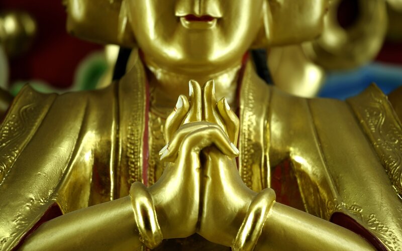 Golden Buddha statue hands