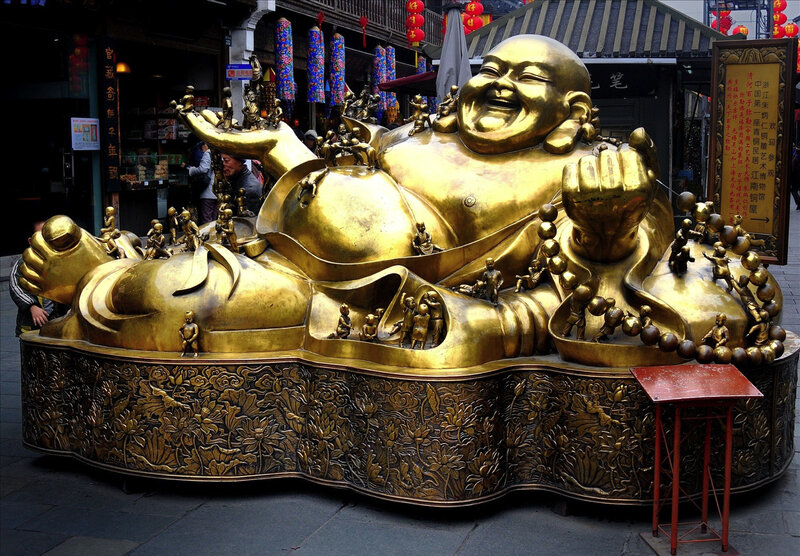 Golden Buddha statue in market