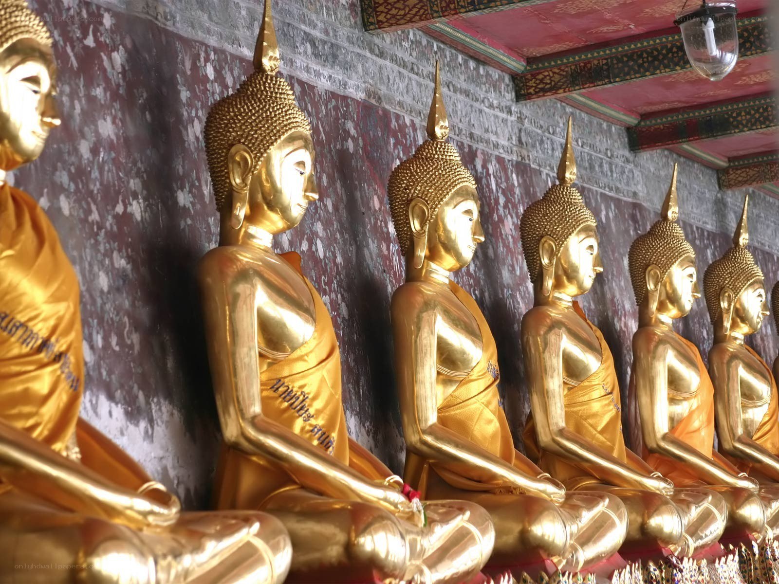 Golden Buddha statues in row