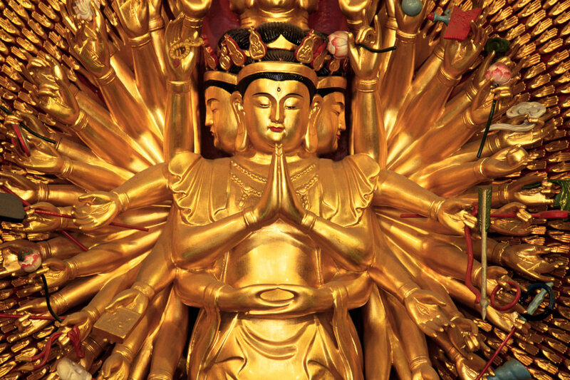 Golden Buddha with multiple arms