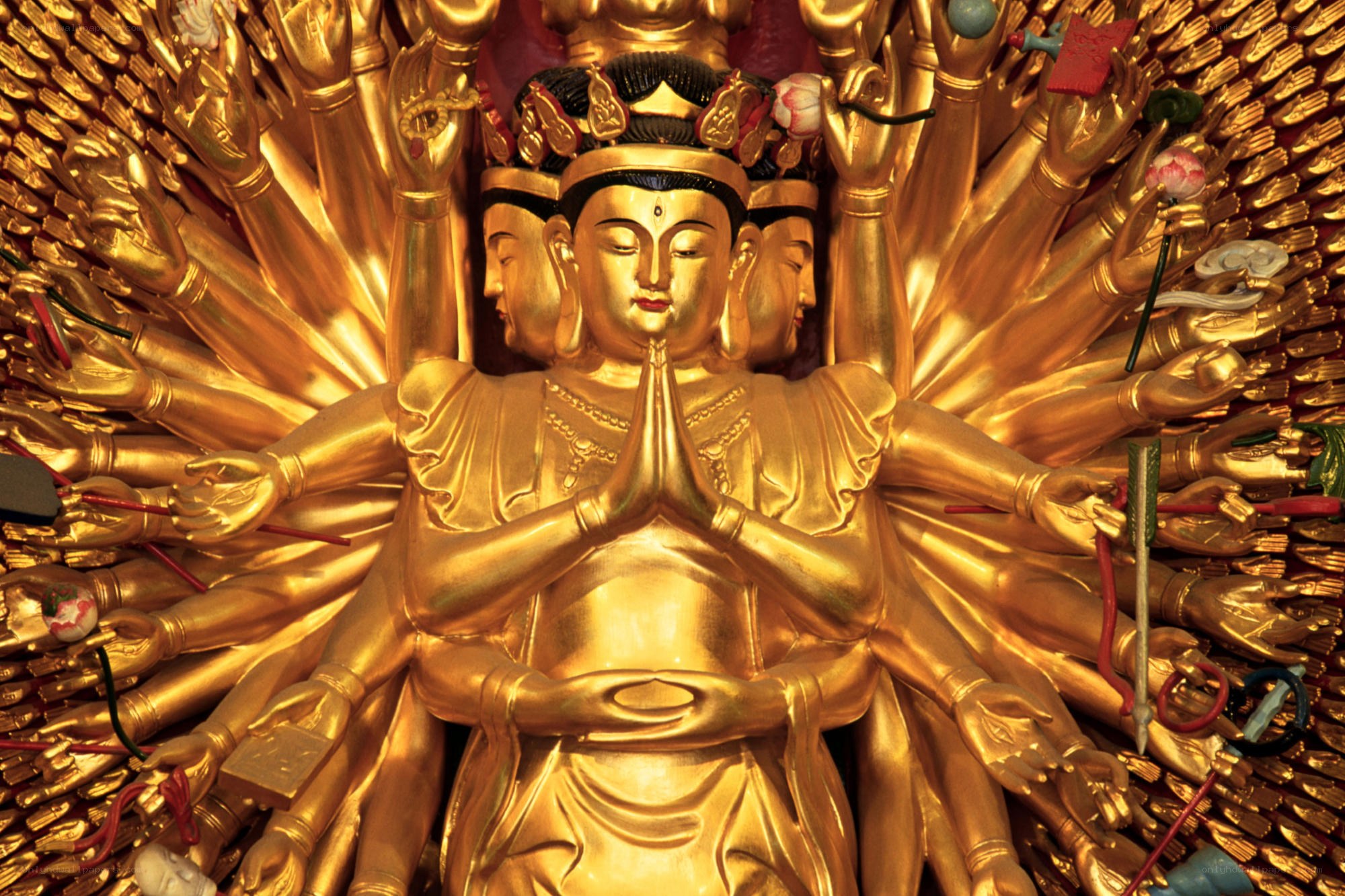 Golden Buddha with multiple arms