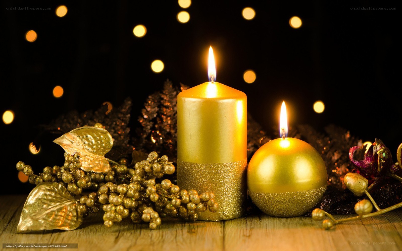 Golden candles and holiday decor