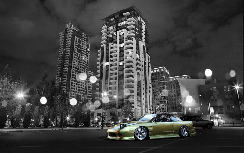Golden car in city at night