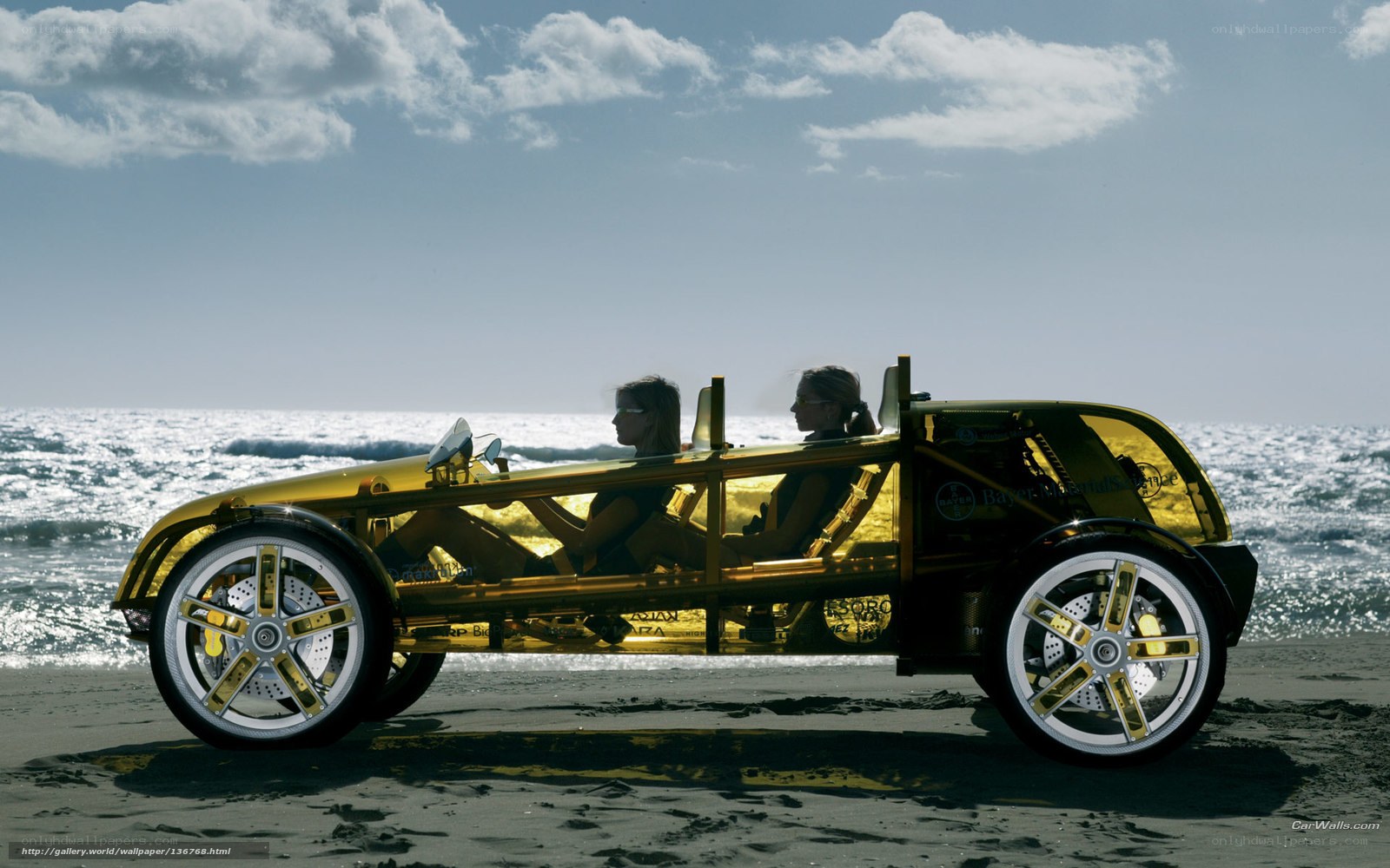 Golden car on the beach