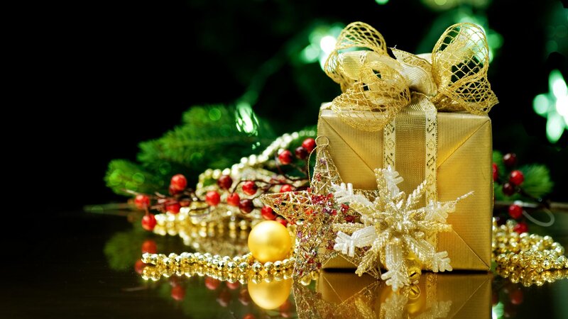 Golden Christmas gift with ornaments