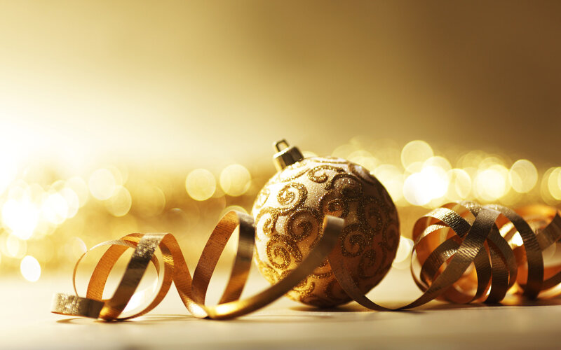 Golden Christmas ornament with ribbon