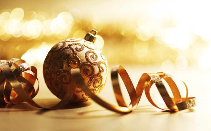 Golden Christmas ornament with ribbon