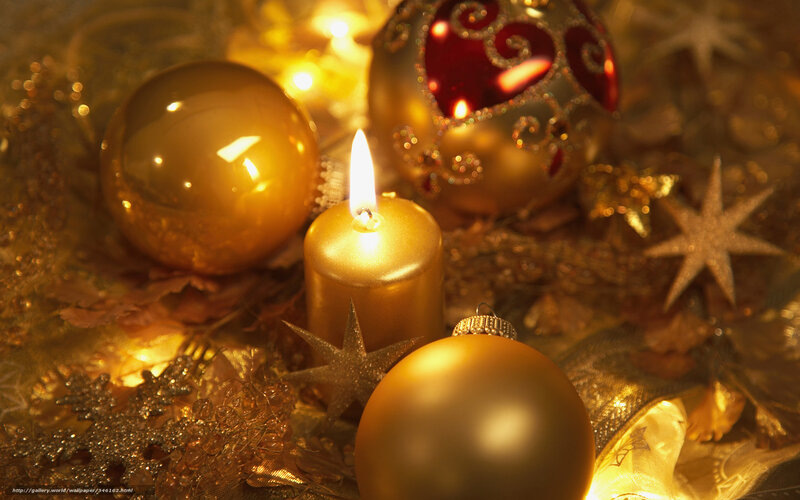 Golden Christmas ornaments and candle