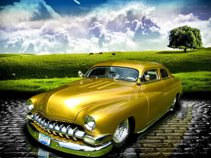 Golden classic car on cobblestone