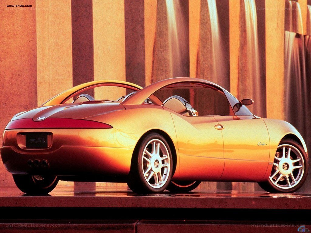 Golden concept car at sunset