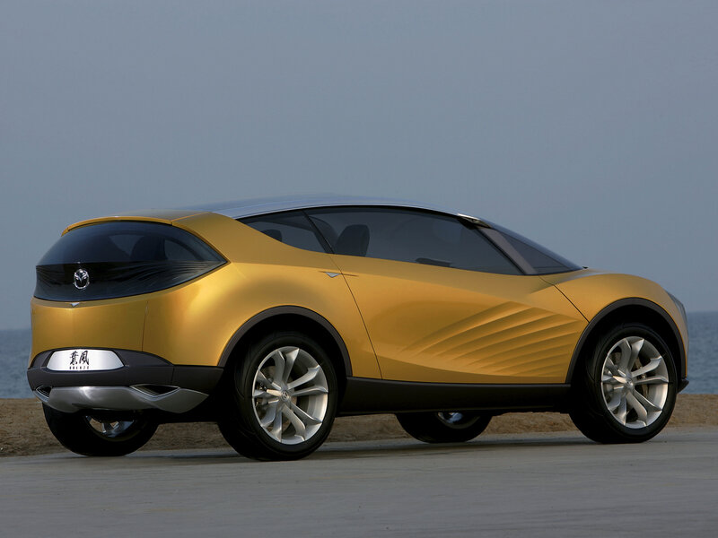 Golden concept car by the sea