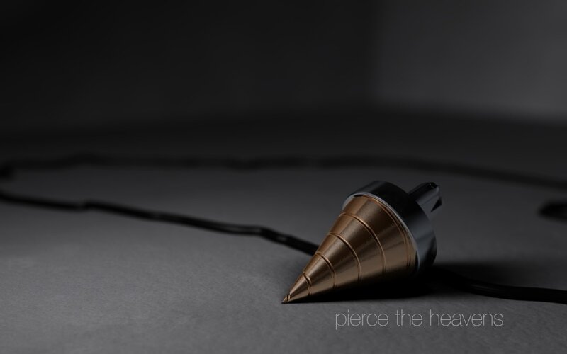 golden cone object on dark surface