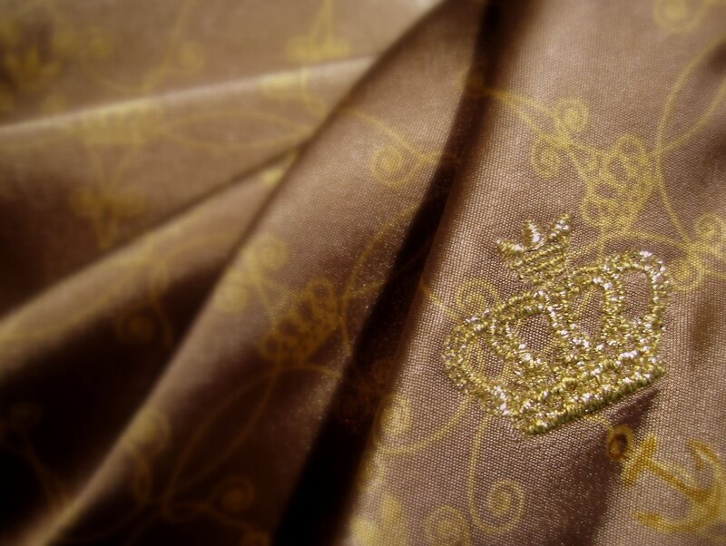 golden crown embroidery on fabric