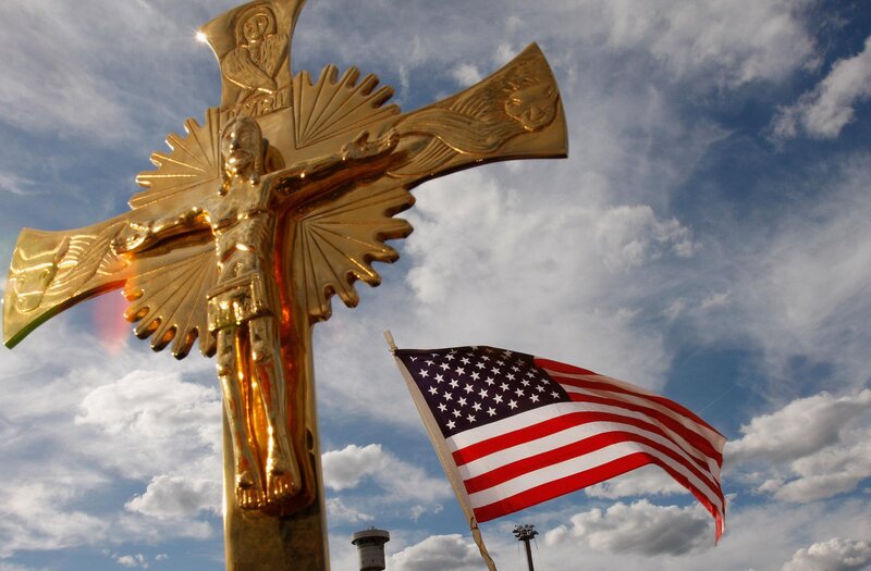 Golden crucifix and American flag