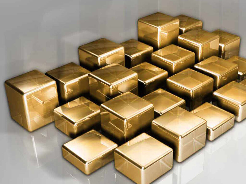 golden cubes on reflective surface