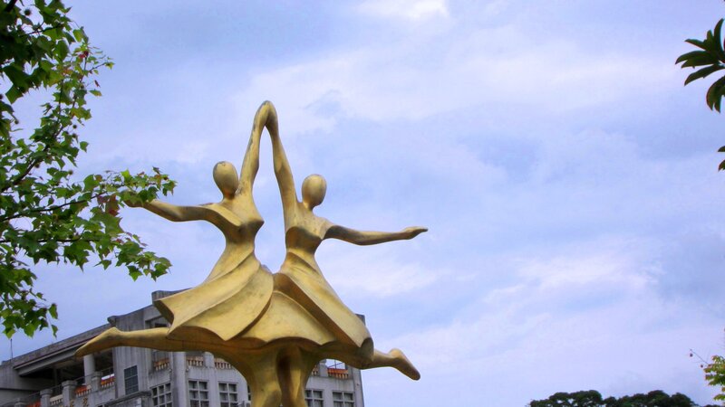 Golden Dancing Figures Sculpture
