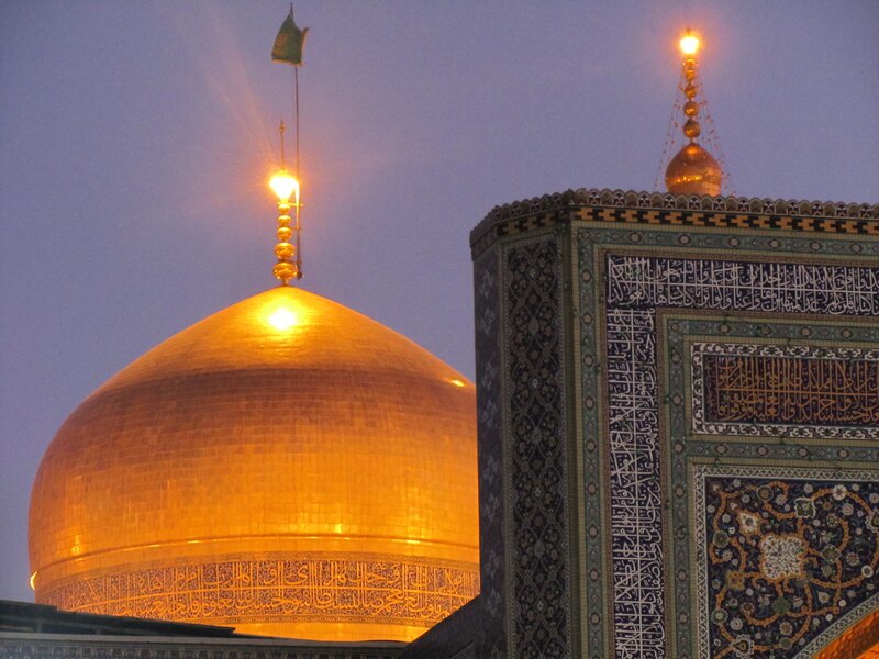 Golden dome of a mosque at dusk