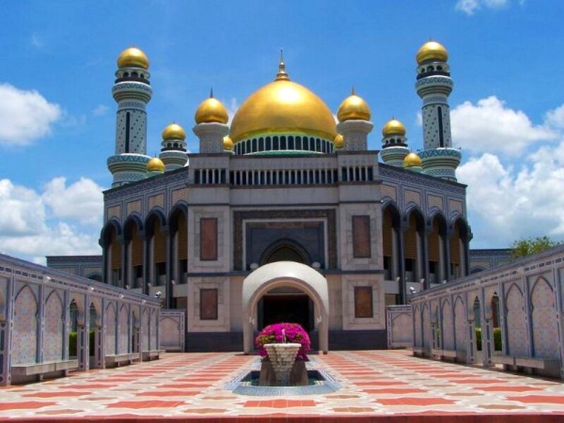 Golden-domed mosque under blue sky