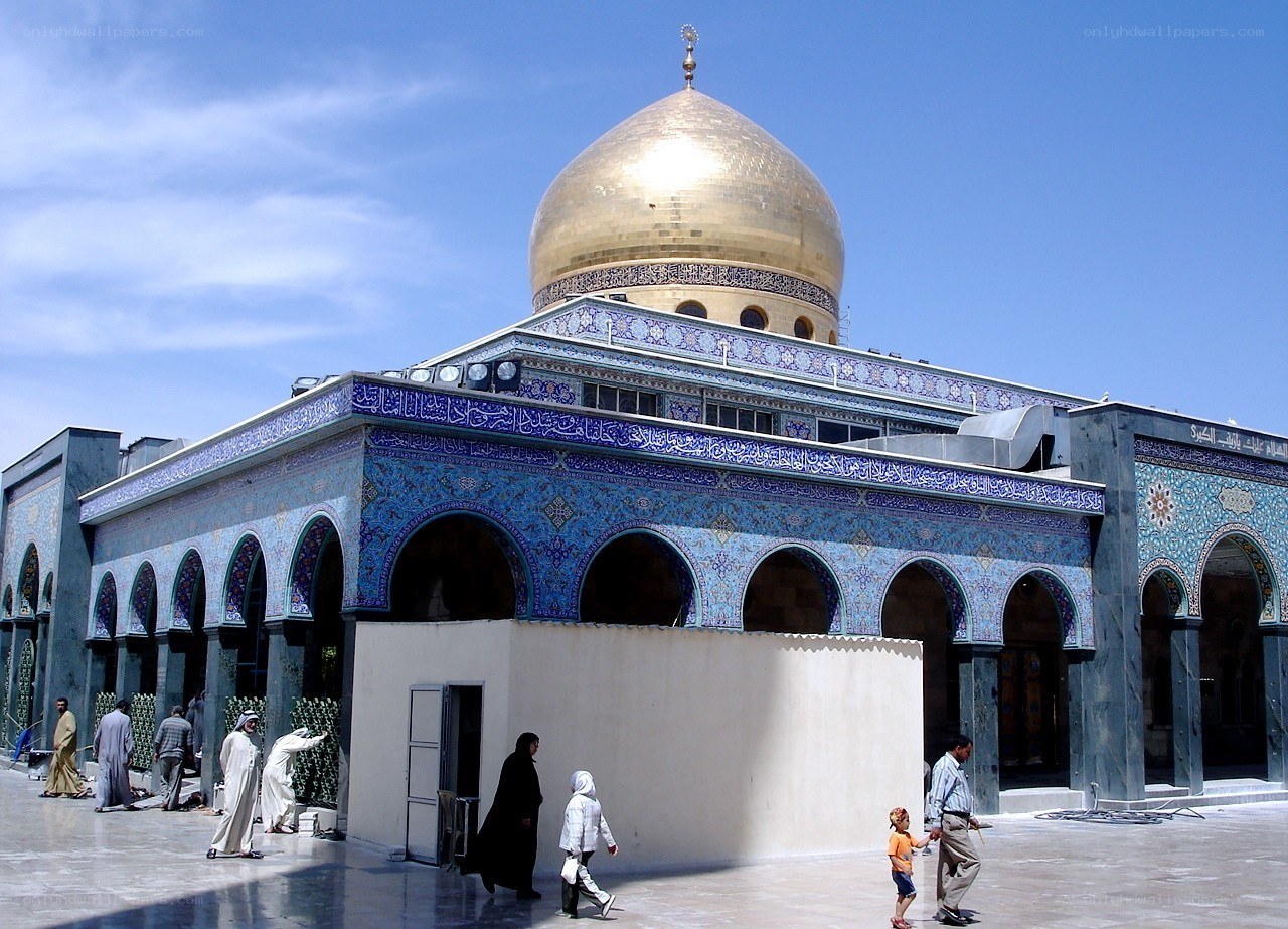 Golden-domed mosque with blue tiles