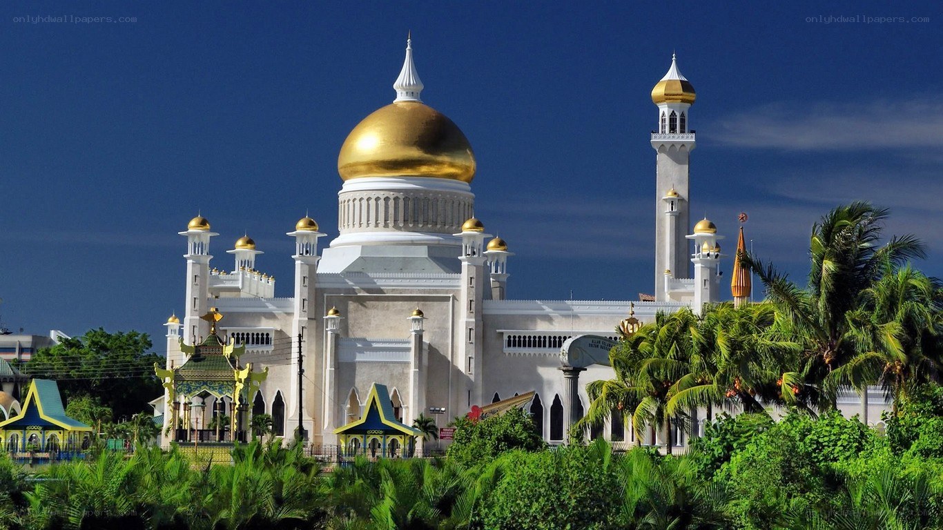 golden-domed mosque with palm trees