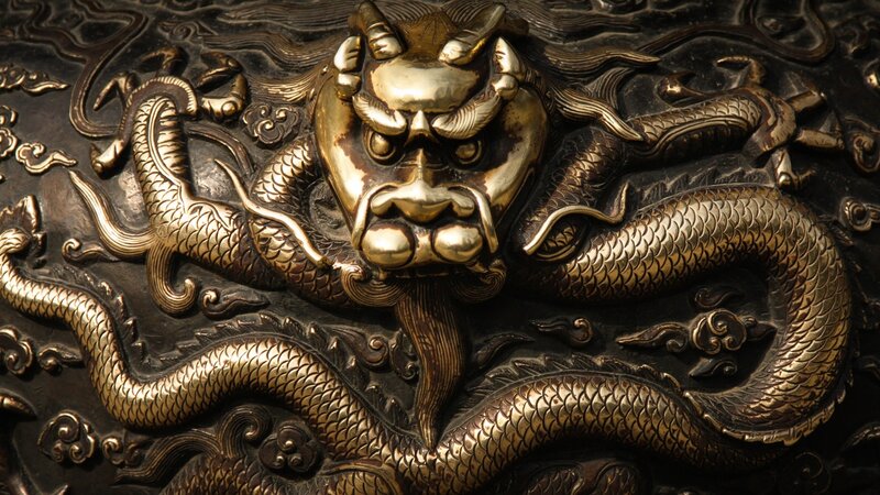 Golden dragon carving on metal