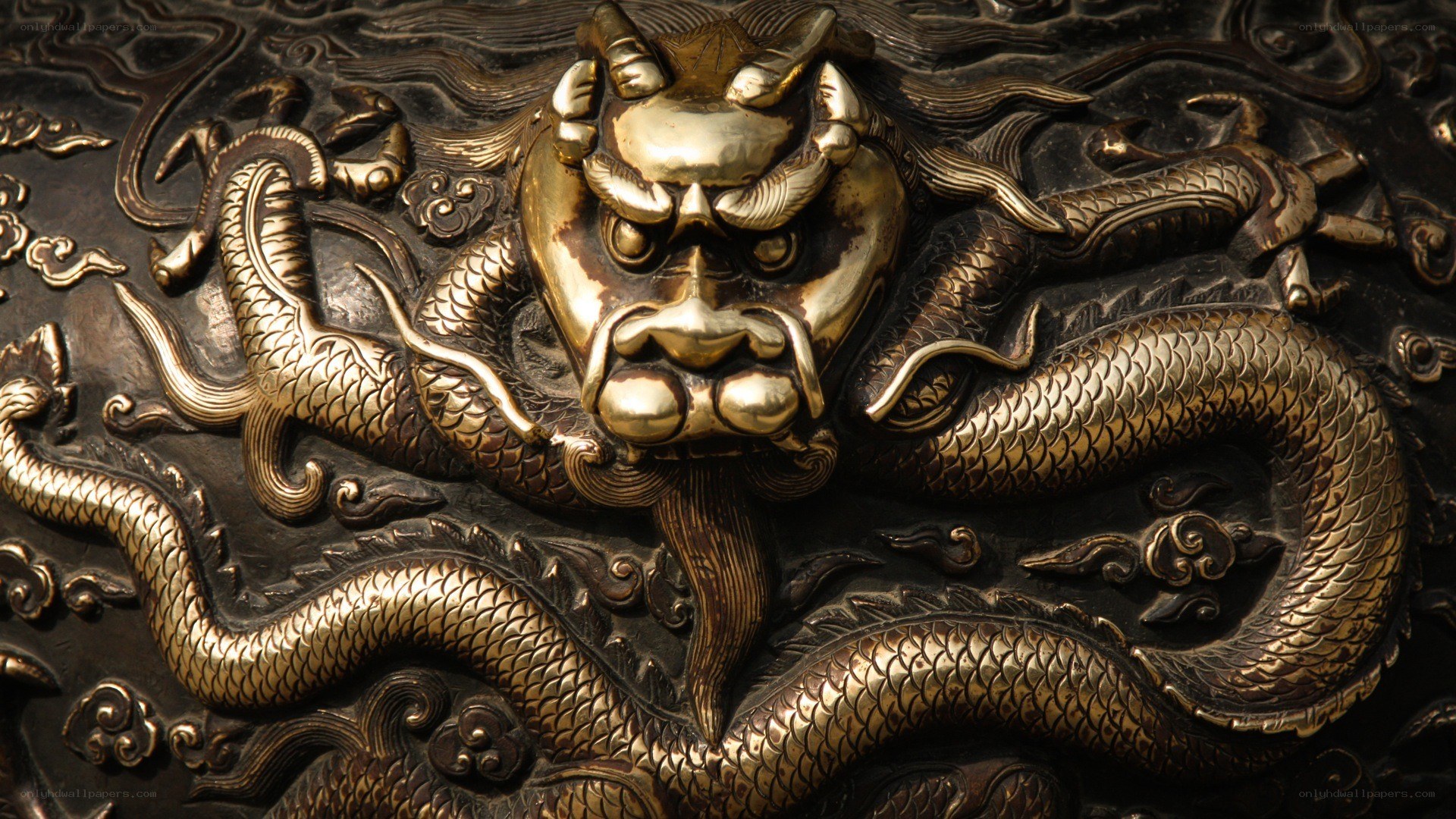 Golden dragon carving on metal