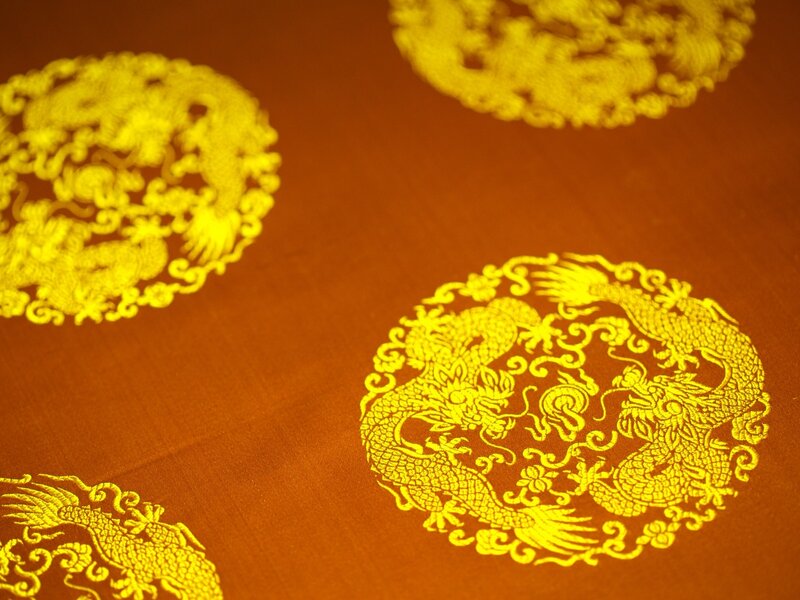 Golden dragon patterns on fabric
