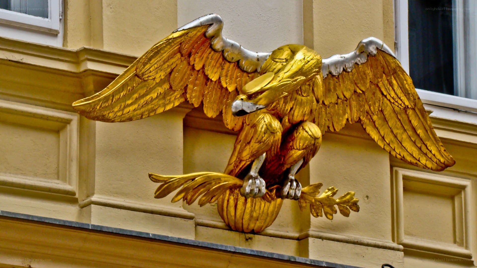 Golden eagle sculpture on building