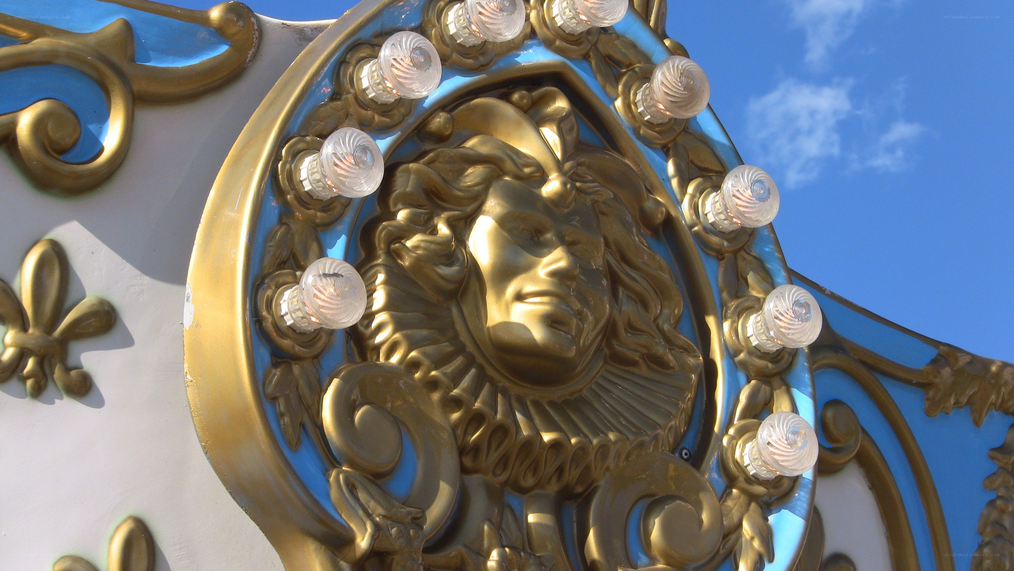golden face on carousel