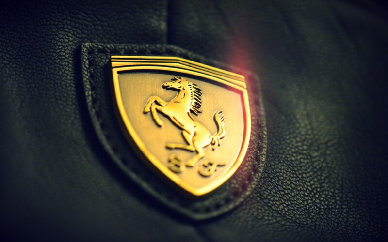 Golden Ferrari Emblem — Black, Dramatic, Photograph