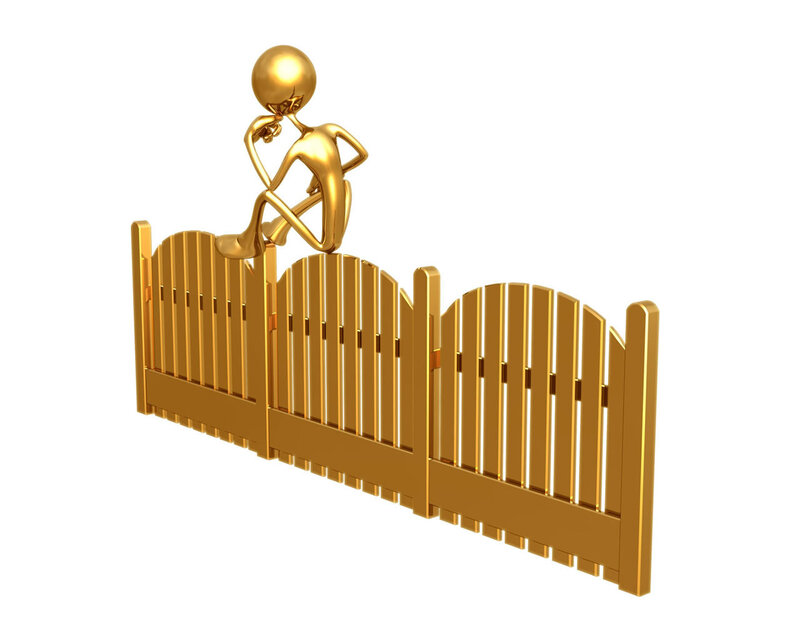 golden figure on fence