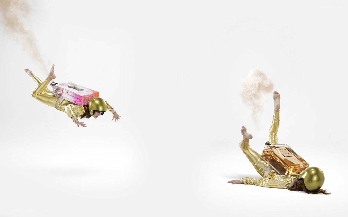 Golden figures with perfume bottles