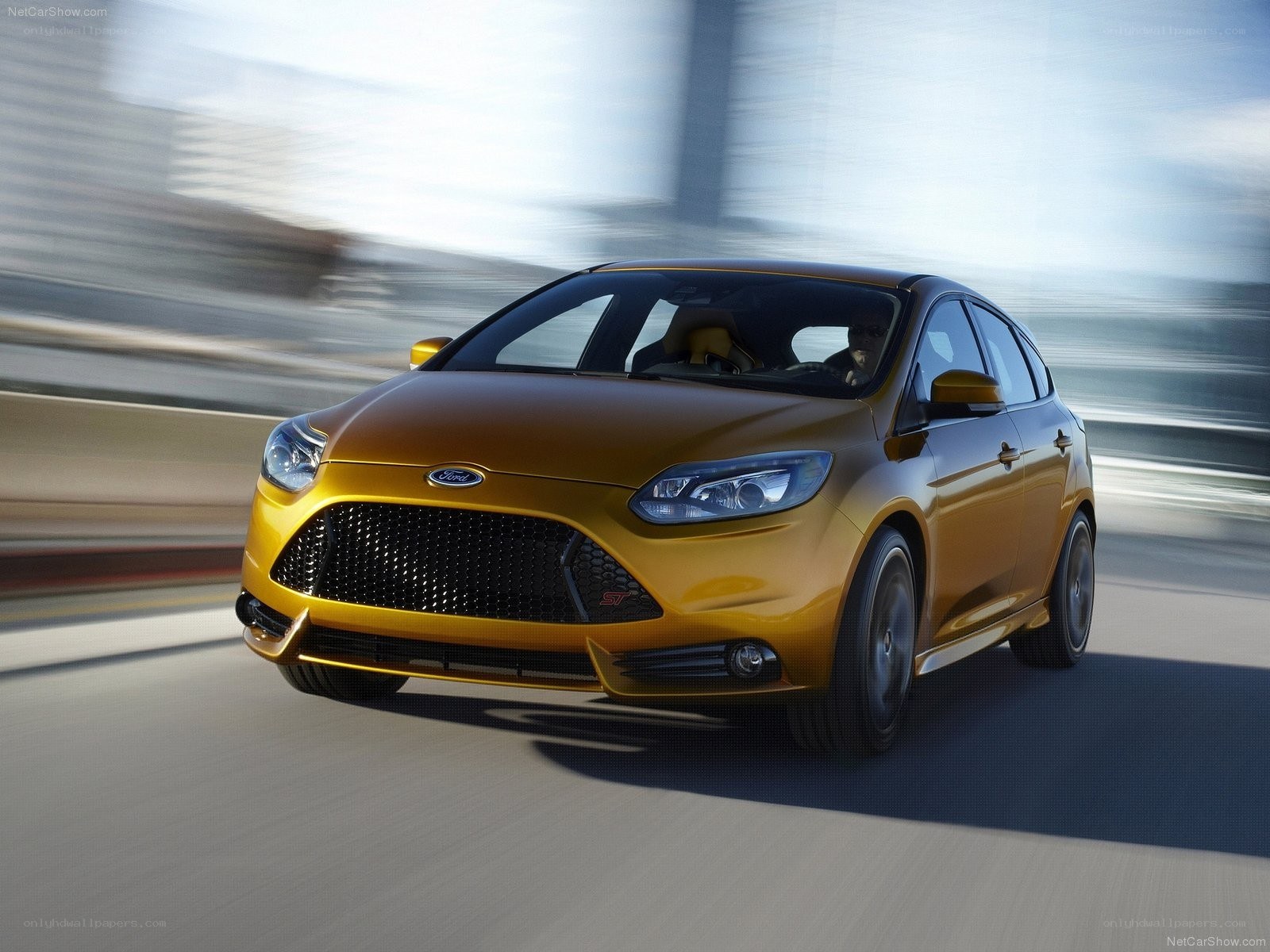 Golden Ford Focus ST in motion