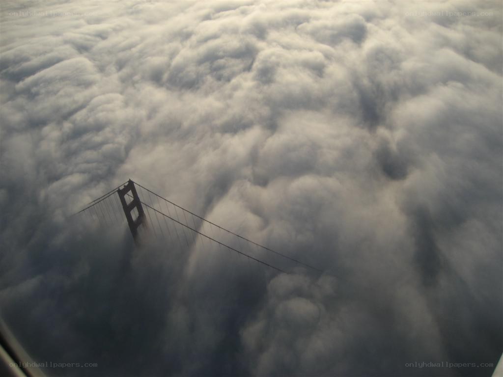 Golden Gate Bridge above clouds