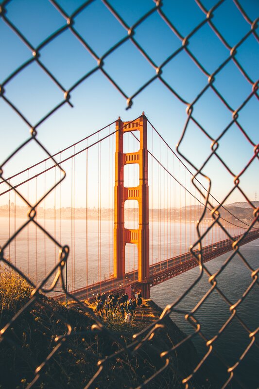 Golden Gate Bridge — Blue, Serene, Sunset, Photograph, Chain-link Fence