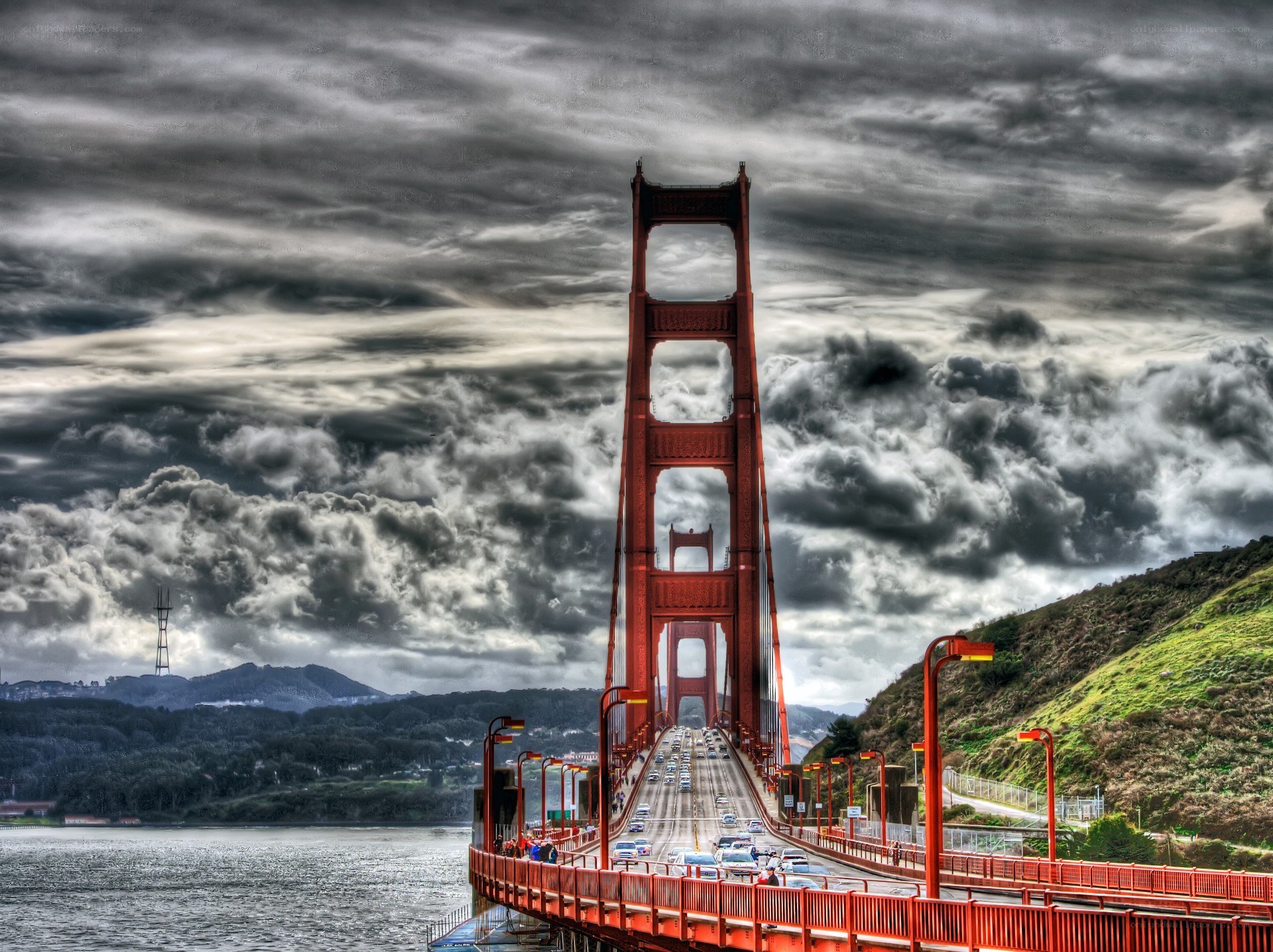 Golden Gate Bridge under stormy sky