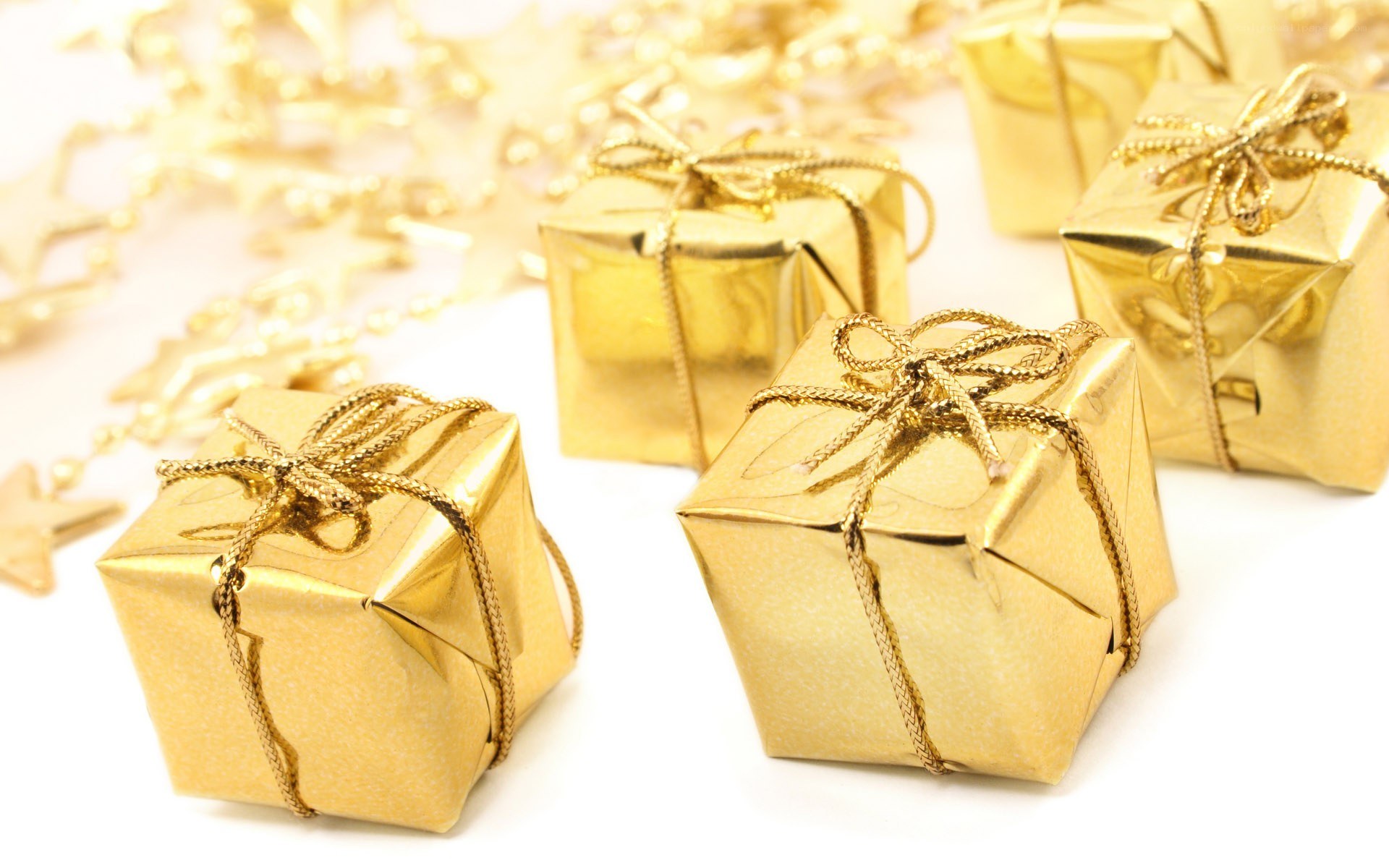 golden gift boxes with ribbons