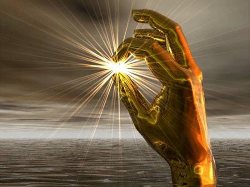 golden hand holding light
