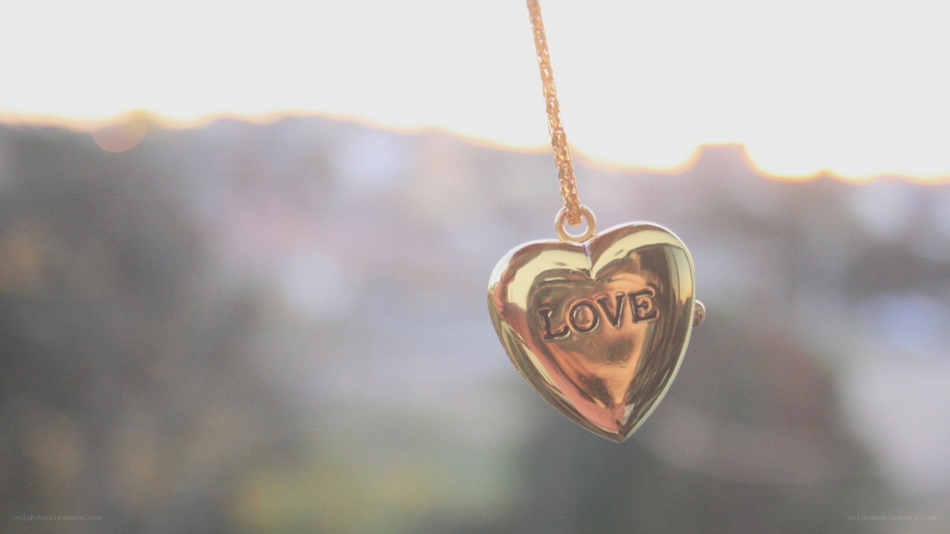 golden heart pendant with love