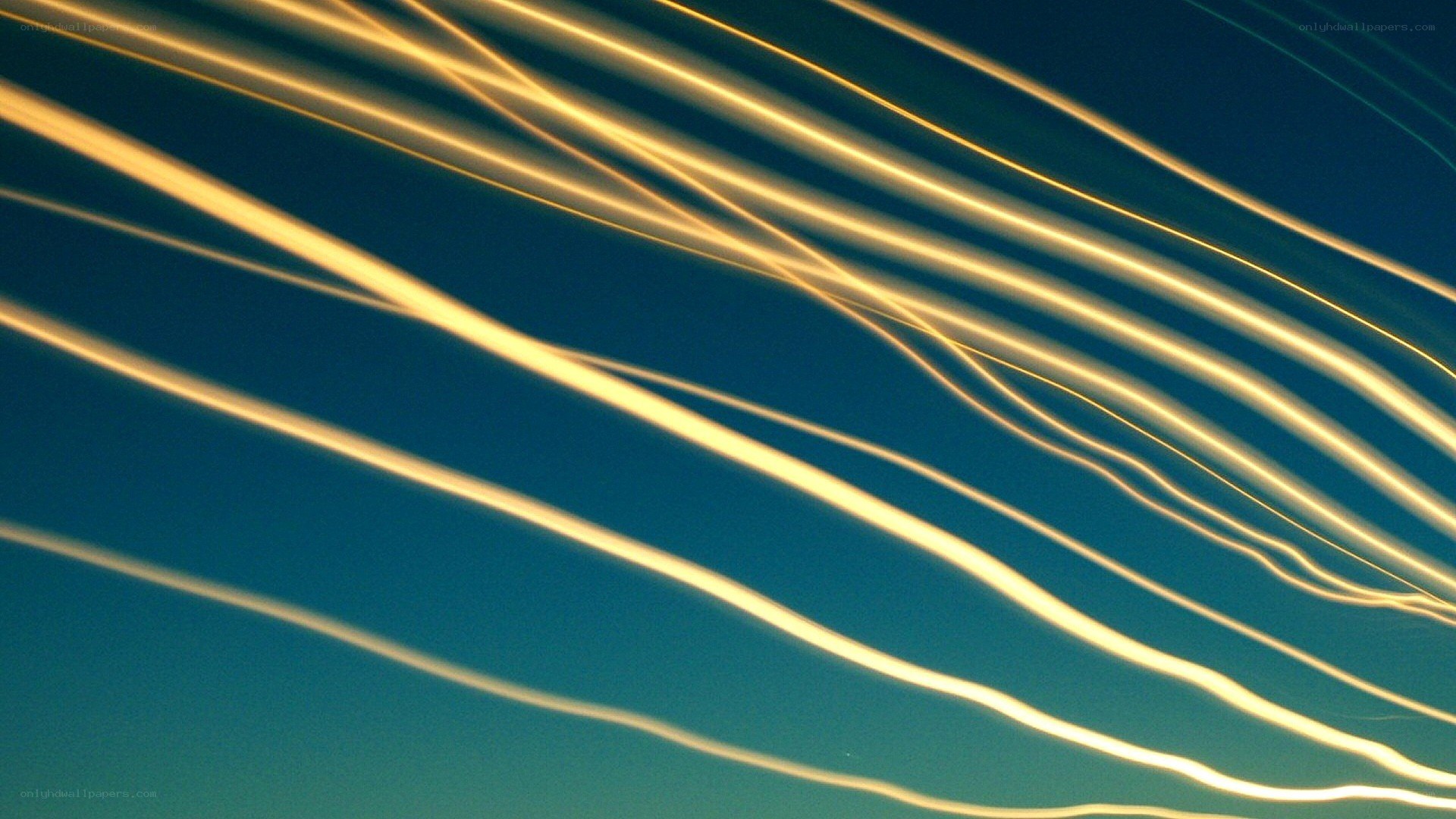 Golden light trails on blue