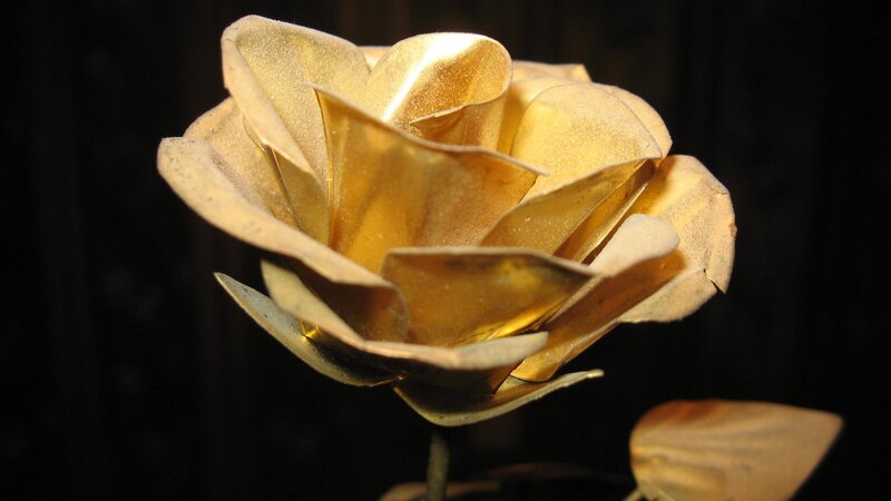 golden metal rose sculpture